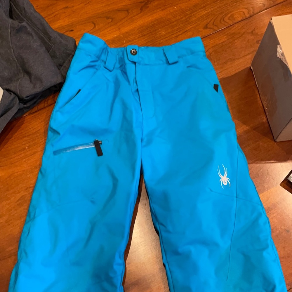Spider ski pants. Pant legs “grow” an inch. Can be rehemmed if too long